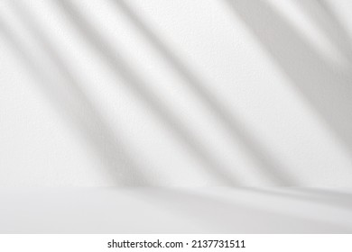 White wall   table and diagonal light   shadows for product presentation  Abstract gradient background in the room 
