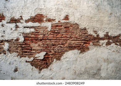 white walls that look like red bricks are cracked and corroded like an abstract art painting - Powered by Shutterstock