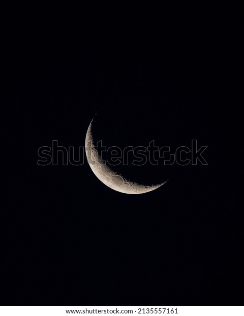 White Waning Crescent\
Moon with Craters