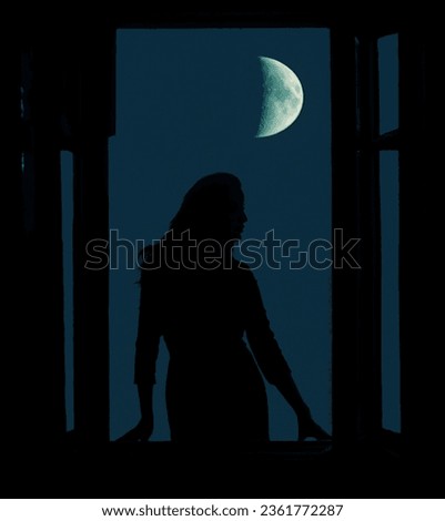 white waning moon in night dark blue sky. Black silhouette of magical witch woman looking out of an open balcony window. evening heaven background. insomnia idea. young lunatic girl. waxing crescent