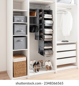White wardrobe with clothes, Shoe Rack Organizer and accessories. Modern interior design. - Shutterstock ID 2348366565