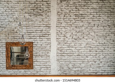 White Washed Brick Walls With Lamps And Mirror On The Wall