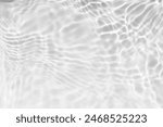 White water with ripples on the surface. Defocus blurred transparent white colored clear calm water surface texture with splashes and bubbles. Water waves with shining pattern texture background.