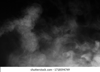 White Water Vapour On Isolated Black Background. Abstract Of Steam With Copy Space. Steam Flow. Smoke On Black Background.