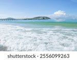 White waves clouds and boats in Yalong Bay Hainan China