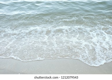 White waves on the sand