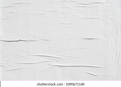 white weathered glued advertising poster