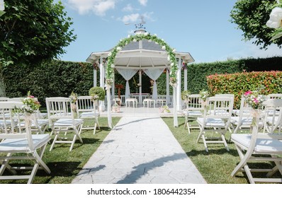 White Wedding Altar And Chairs