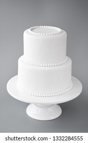 White Wedding Cake Blank On A Gray Background. Simple Minimalism.