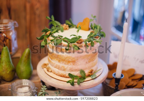 White Wedding Cake Decorated Greenery Stands Food And Drink