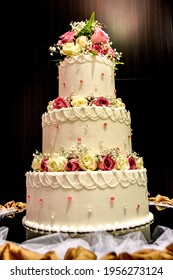 White Wedding Cakes That Are Built Tall. Nice Design And Unique With Lots Of Attention To Detail.