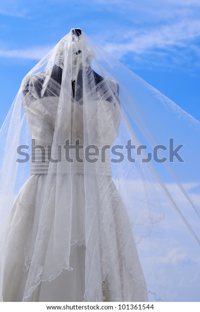 White Wedding Gown Shot Against Blue Stock Image Download Now