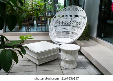 White Wicker Chair Standing At Restaurant.