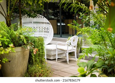 White Wicker Chair Standing At Restaurant.