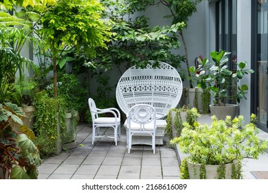 White Wicker Chair Standing At Restaurant.