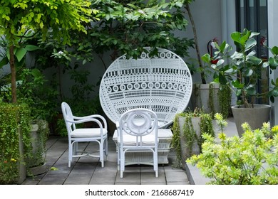 White Wicker Chair Standing At Restaurant.