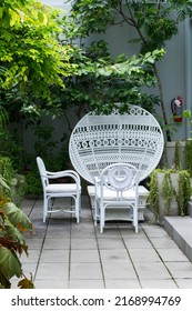 White Wicker Chair Standing At Restaurant.