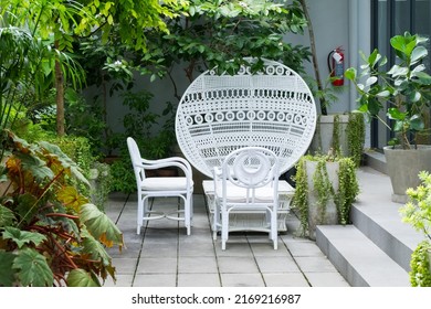 White Wicker Chair Standing At Restaurant.