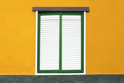 White Window Shutters Background. Empty Copy Space Home Wall. Architecture Texture. Green Window Frame Isolated On Orange House Wall Facade. Wooden Stripes Window. European Architecture Background.