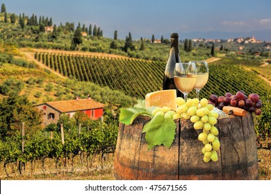 White wine with barrel on famous vineyard in Chianti, Tuscany, Italy