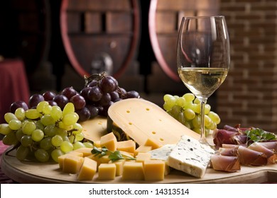 White Wine In Fine Glass With Cheese And Grape