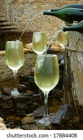 White Wine Fountain Pouring In Glasses