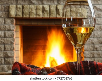 White Wine  In A Glass, Before  Cozy Fireplace, In Country House, Winter Vacation Or Christmas Evening.