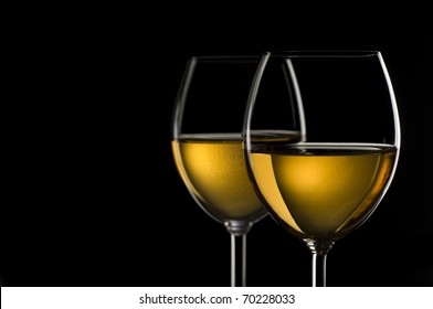 White Wine In Glass On Black Background Close Up