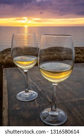 White Wine Glasses With Mexico Coast At Sunset In Background