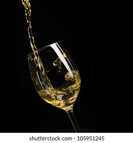 White Wine Poured Into Glass