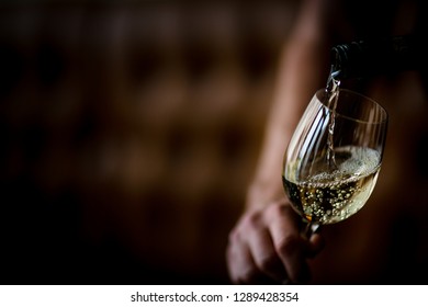 White Wine Pouring In To Wine Glass