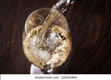 White Wine Pouring Into Glass