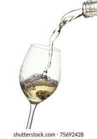 White Wine Pouring Into A Glass From A Bottle