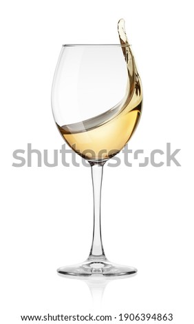 white Wine splash in glass isolated on white background, full depth of field, clipping path