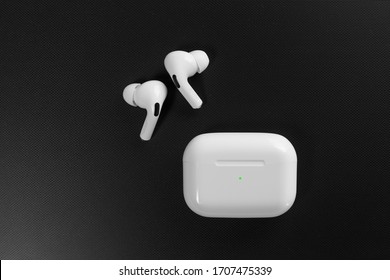 white wireless headphones on black background. copy space. Copy space Copy space