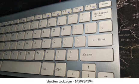 White Wireless Keyboard With Black Mousepad