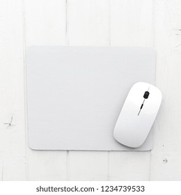 White Wireless Mouse On A Mouse Pad, Top View