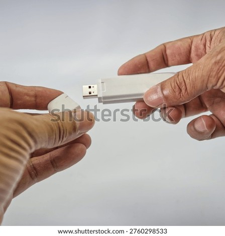 White wireless USB dongle device for mobile broadband internet access on computers and laptops
