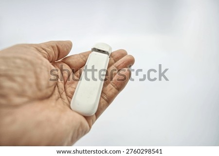 White wireless USB dongle device for mobile broadband internet access on computers and laptops