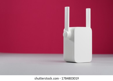 White Wireless WiFi Repeater With Antenna. Copy Space.