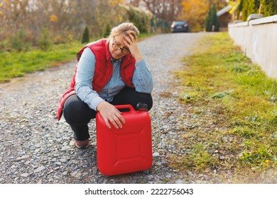 White Woman In Red Vest Holding Red Gasoline Container And Posing On Scenic Nature Country Road