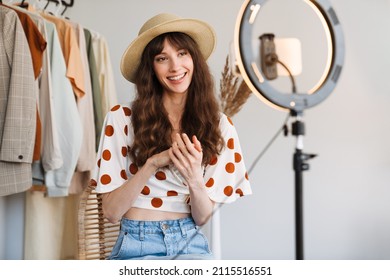 White Woman Smiling While Taking Selfie Footage On Cellphone At Home