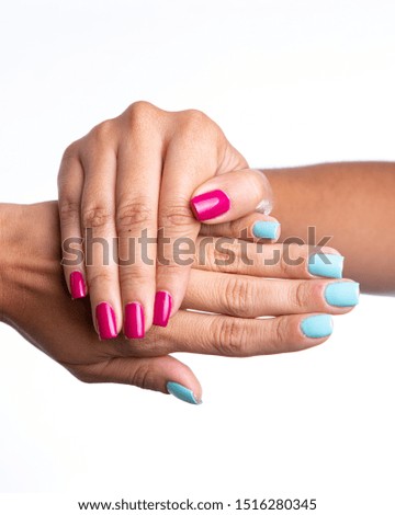 white woman's hands with painted nails on white background