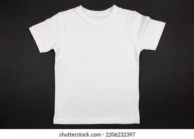 White Womens Cotton Tshirt Mockup On Black Background. Design T Shirt Template, Print Presentation Mock Up. Top View Flat Lay. 