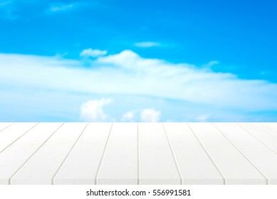 White Wood Table And Blue Sky Background.