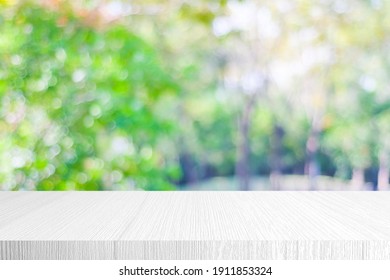 White Wood Table, Counter Background, White Wooden Shelf And Blur Green Tree Nature For Food Picnic,  Product Display Backdrop, Table Top Surface And Blurred Garden Park In Spring, Summer Outdoor