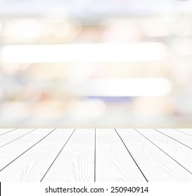 White Wood Table Top Background, Perspective Wooden Shelf Over Blur Abstract Bokeh Light Background, Empty Wood Counter Surface And Blur Store, Cafe, Food And Product Display Mockup, Template, Banner