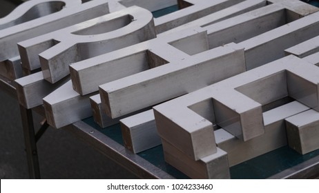 White wooden alphabet letters for sale in a market - Shutterstock ID 1024233460