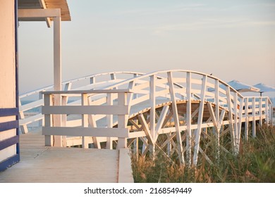 White Wooden Bridge On The Seashore