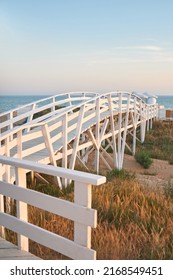 White Wooden Bridge On The Seashore